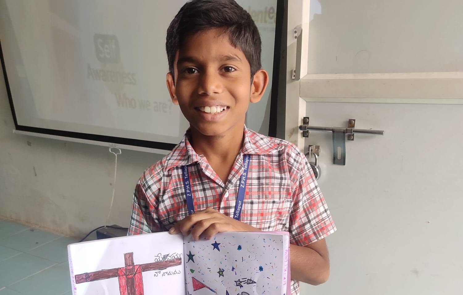 student showcasing his drawing